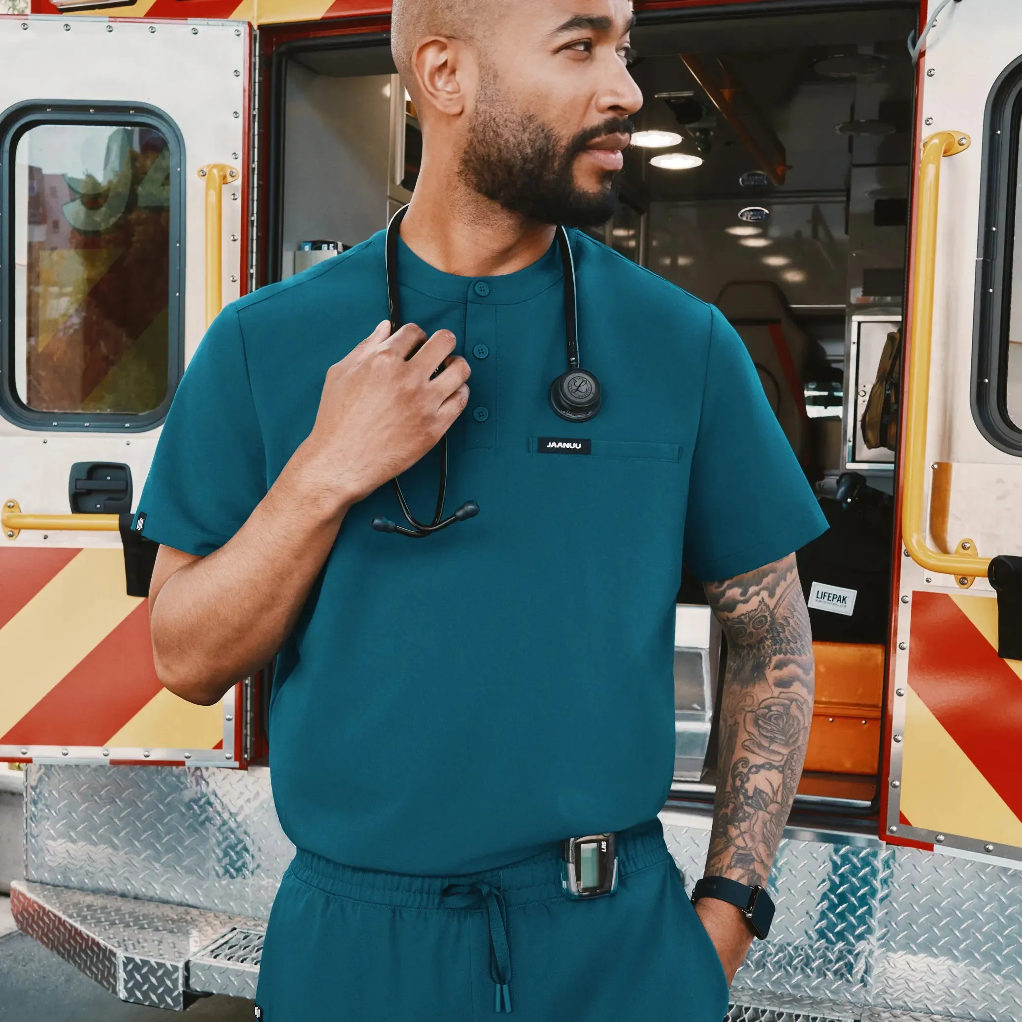 Jaanuu Men's Reeve Henley Scrub Top - Caribbean Blue